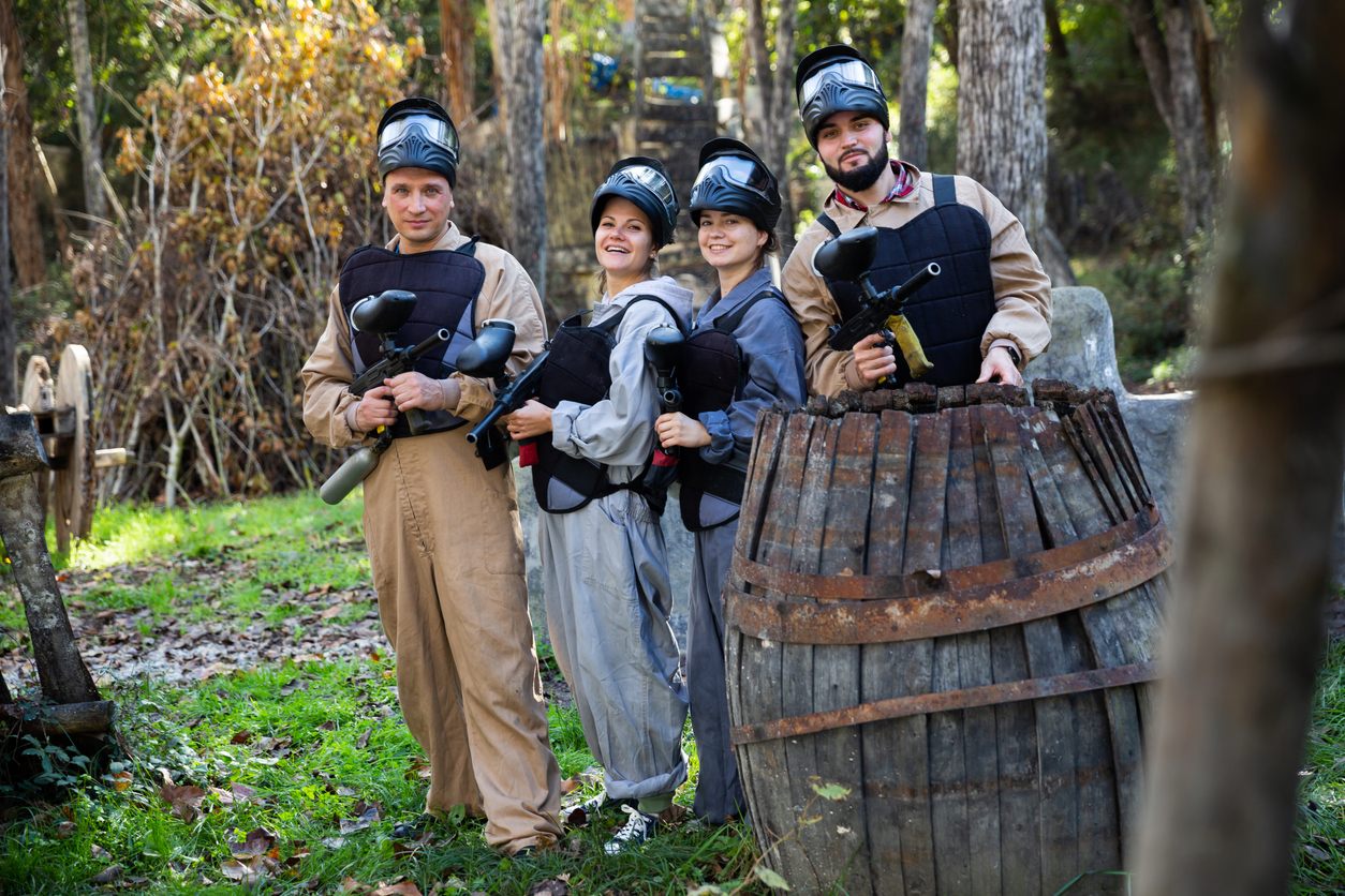 Bachelor party group geared up on the woodsball field